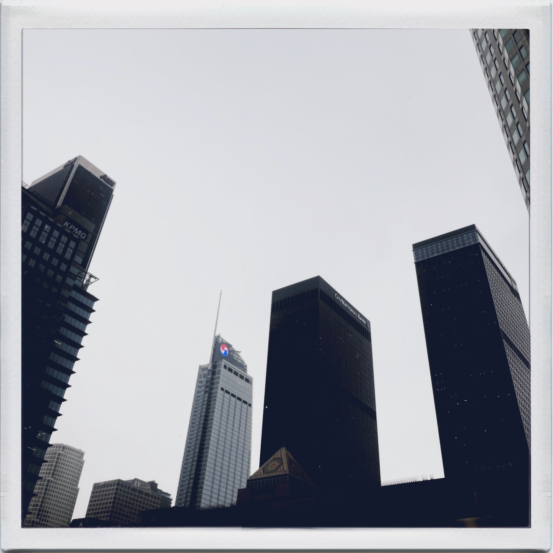 Downtown Los Angeles skyline looking up at office towers where marketer interviews took place.